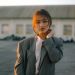 woman in gray blazer smiling
