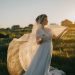 woman wearing wedding gown in green grass field