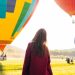 woman standing near hot air balloon