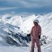 A skier enjoys the snowy mountain views in Gurgl, Tirol in winter.
